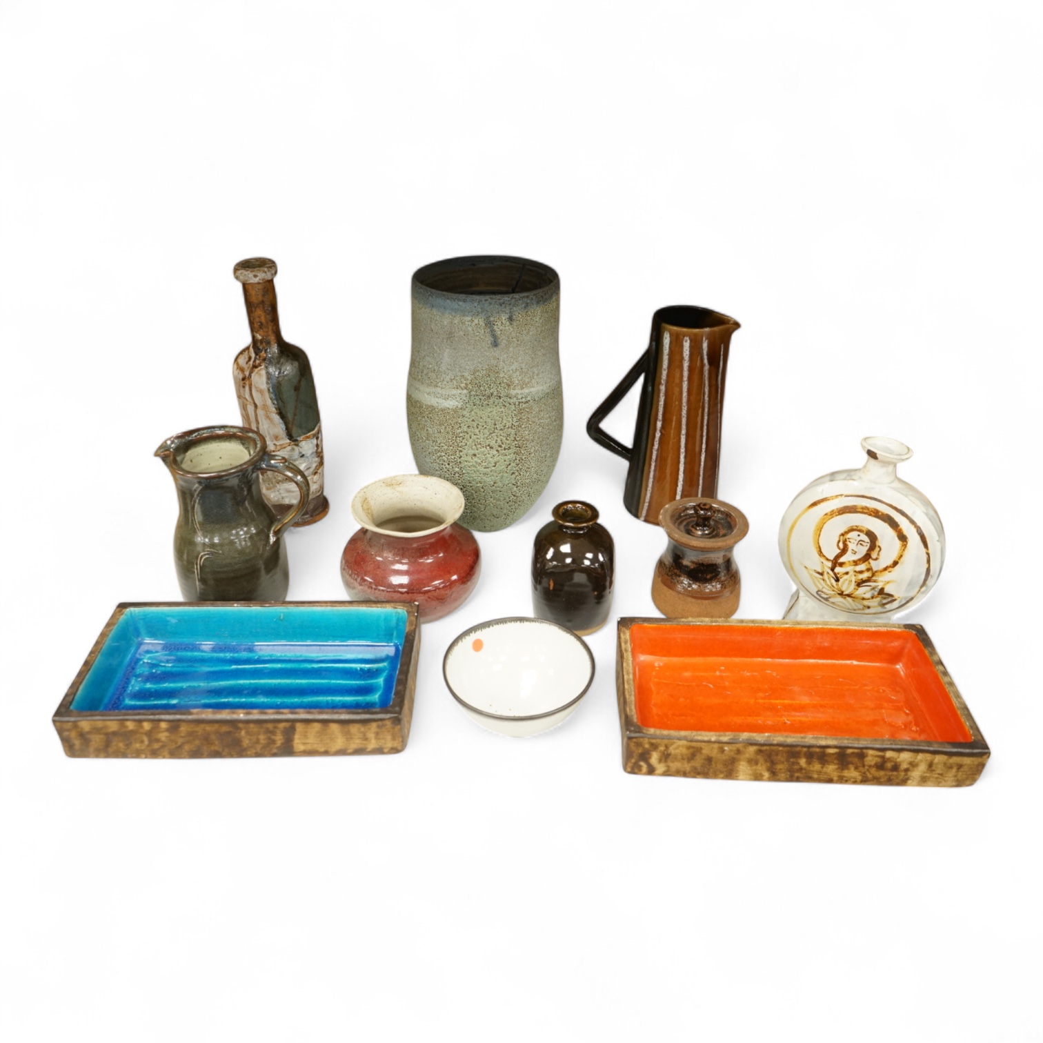 A group of eleven pieces of mixed 1960's-80's pottery to include vases, jugs and two rectangular dishes, largest 34cm high